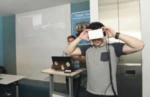 Person interacting with a VR based student project at IDM showcase 2017