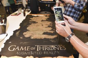 person interacting with mobile AR game of thrones themed project at IDM showcase 2017