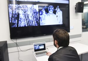 student interacting with a student project on a laptop and projected on a bigger screen at IDM showcase 2017