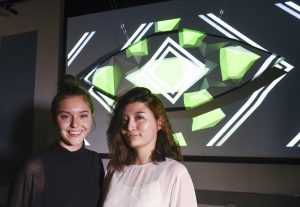 students presenting their project which includes an eye shaped physical installation at IDM showcase 2017